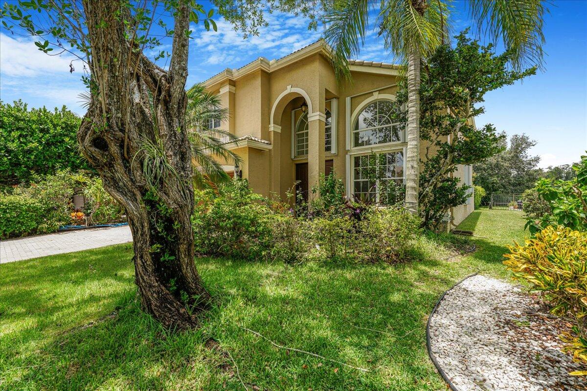 19059 Skyridge Circle Boca Raton, FL 33498 - Photo 10 of 40 a front view of a house with garden