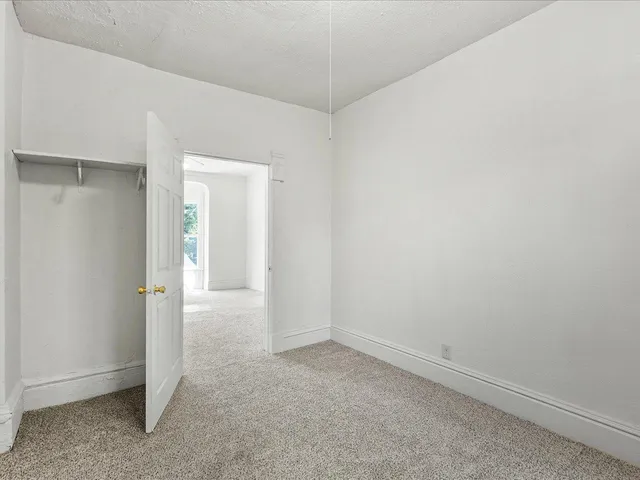 an empty room with a hallway