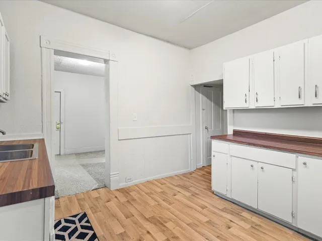 a kitchen with a sink and cabinets