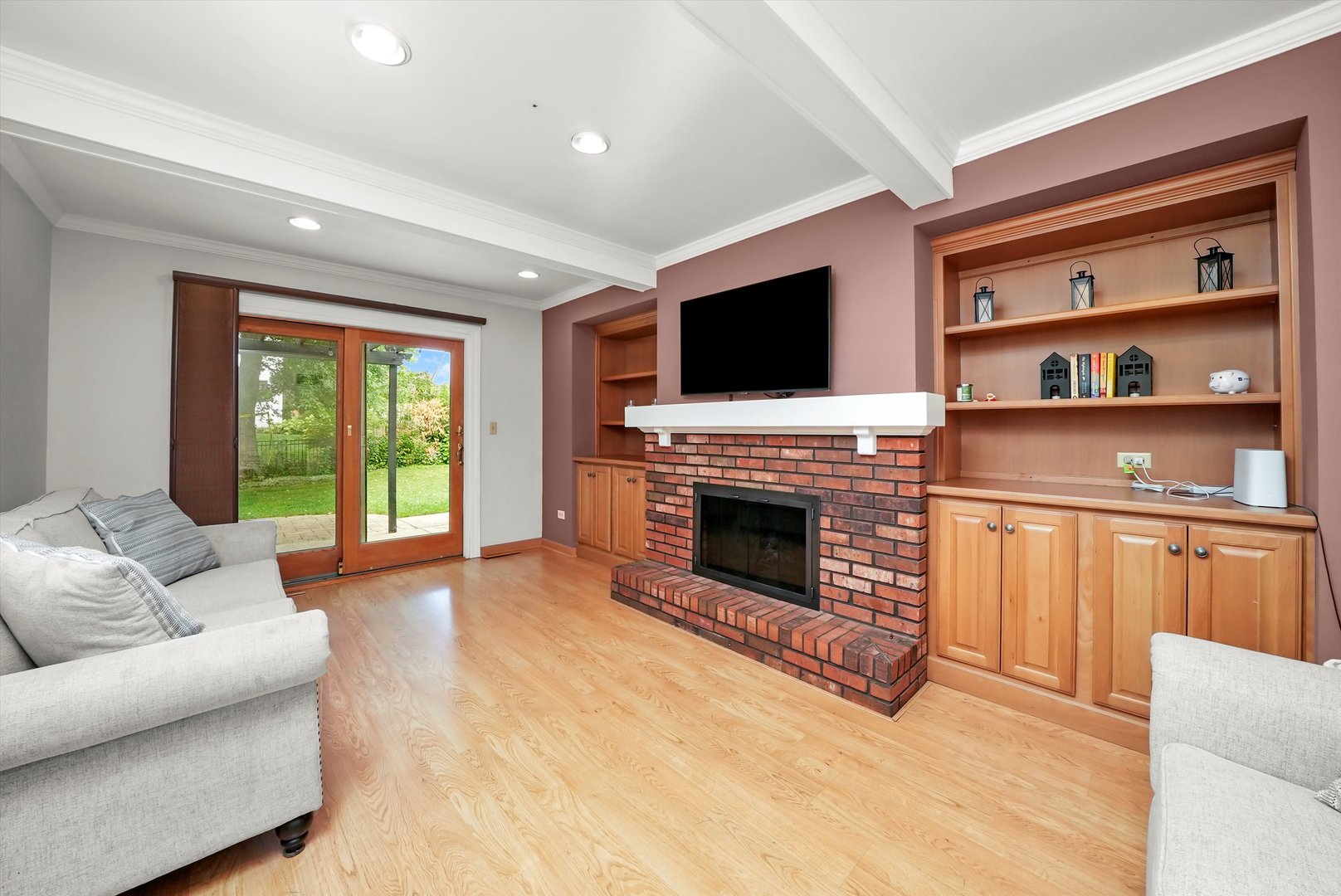 41 Lockman Circle Elgin, IL 60123 - Photo 12 of 46 a living room with furniture a flat screen tv and a fireplace