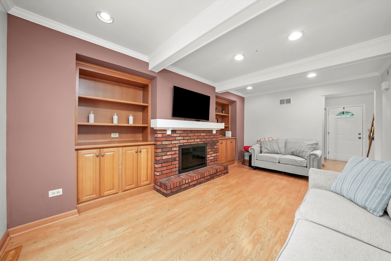41 Lockman Circle Elgin, IL 60123 - Photo 13 of 46 a living room with furniture a fireplace and a flat screen tv