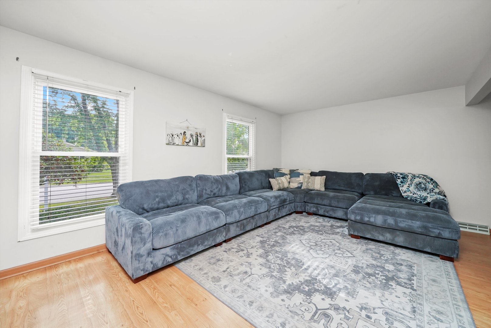 41 Lockman Circle Elgin, IL 60123 - Photo 2 of 46 a living room with a couch and a large window