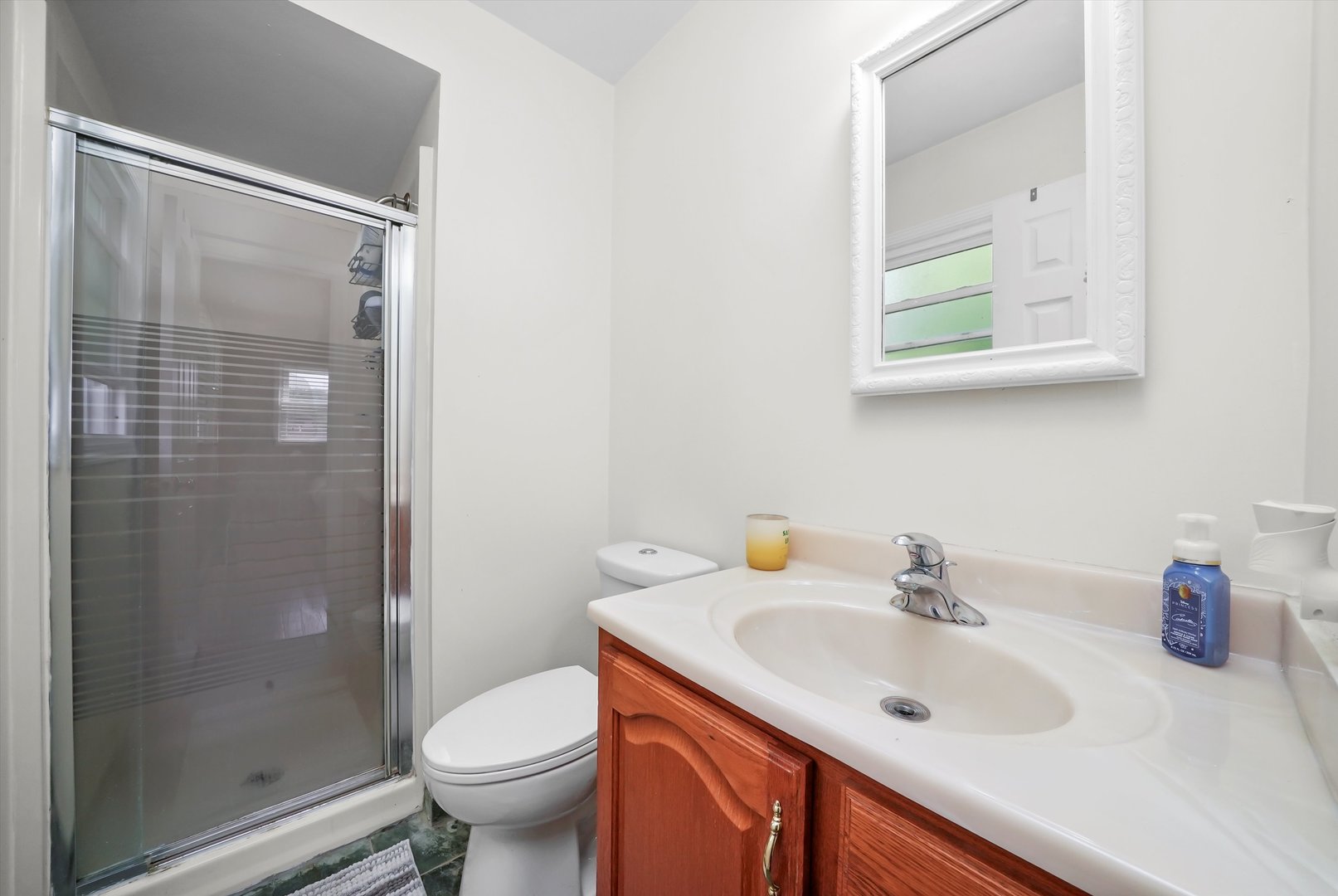 41 Lockman Circle Elgin, IL 60123 - Photo 22 of 46 a bathroom with a sink toilet and a mirror