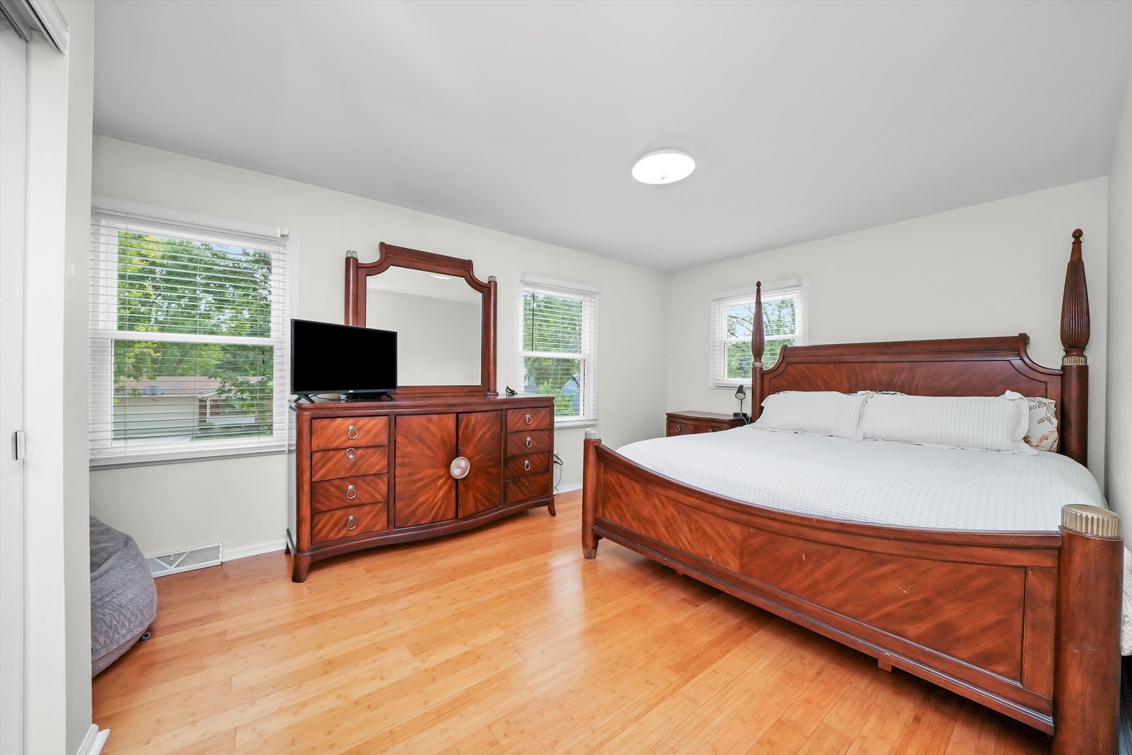 41 Lockman Circle Elgin, IL 60123 - Photo 24 of 46 a bedroom with a bed and a flat screen tv