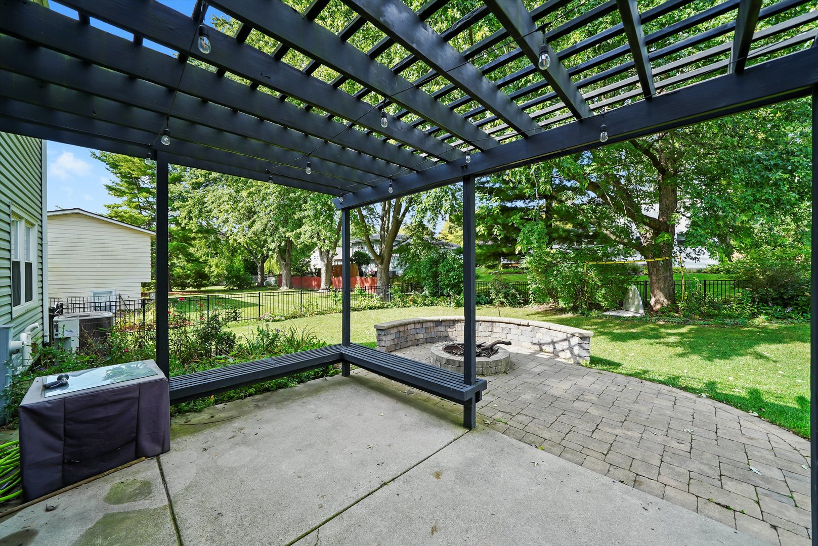 41 Lockman Circle Elgin, IL 60123 - Photo 27 of 46 a swimming pool with some trees in the background