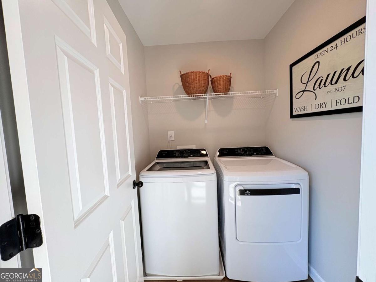 6155 Molo Lane Cumming, GA 30041 - Photo 18 of 29 a utility room with dryer and washer