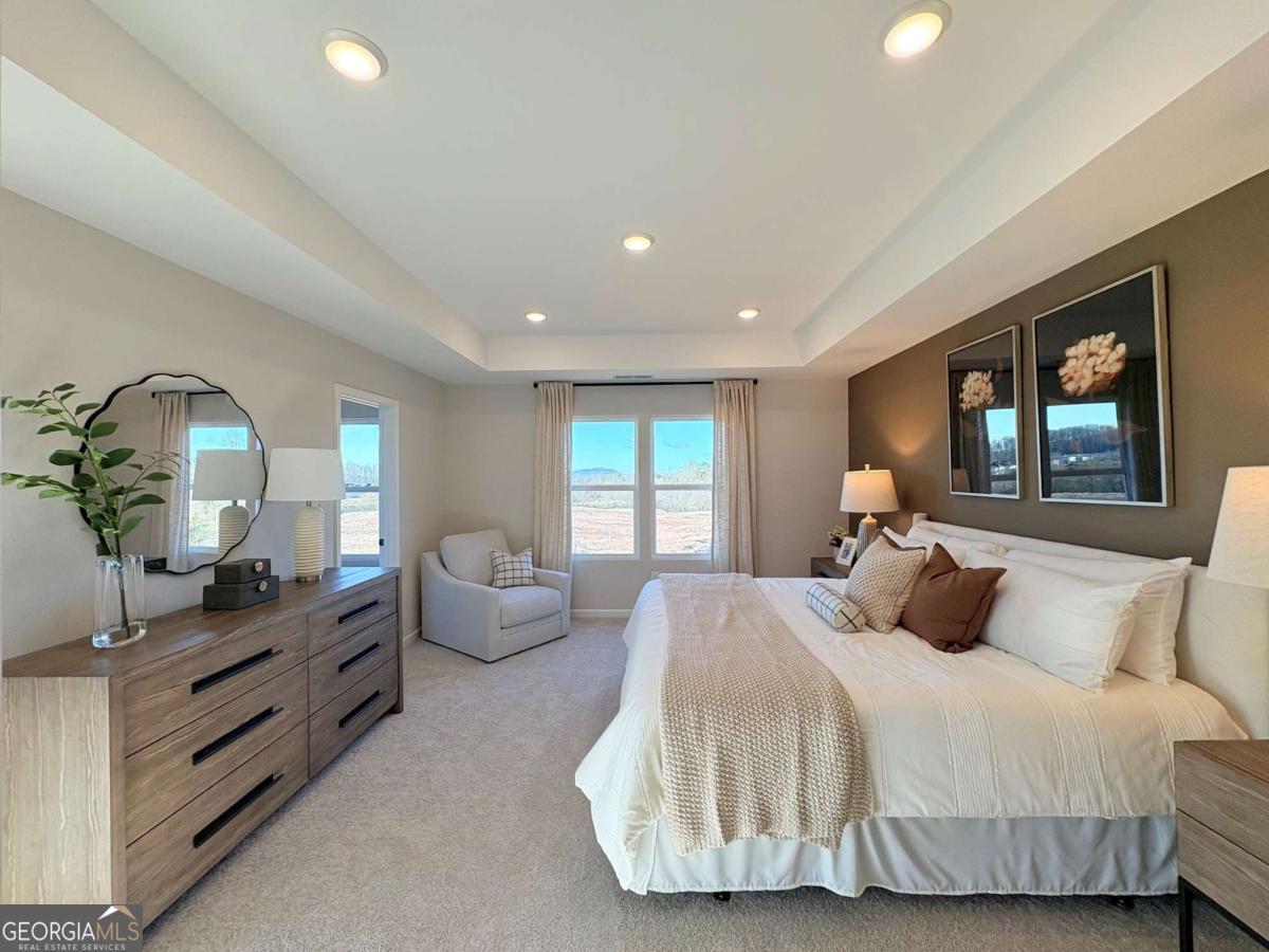6155 Molo Lane Cumming, GA 30041 - Photo 23 of 29 a bedroom with bed and window