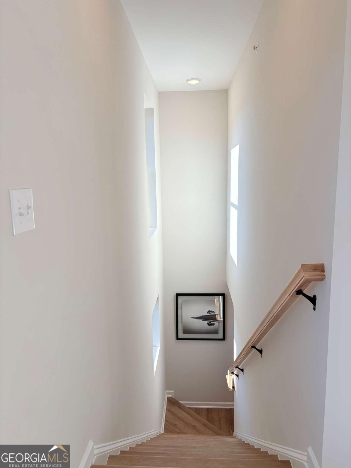 6155 Molo Lane Cumming, GA 30041 - Photo 28 of 29 a view of a hallway with stairs