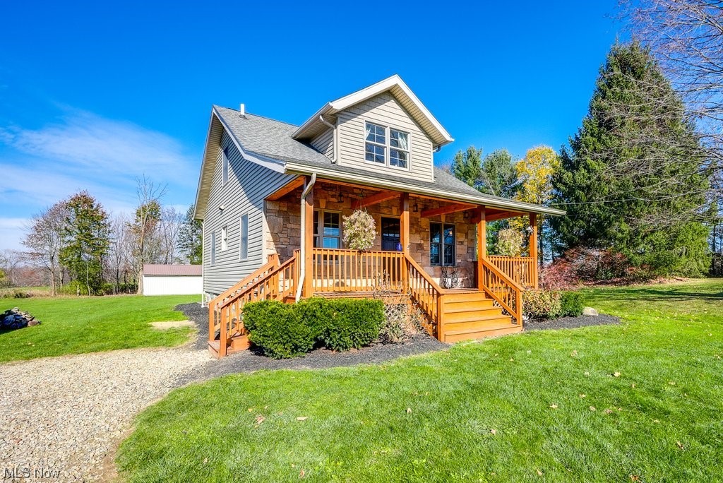 3417 Lake Rockwell Road Ravenna, OH 44266 - Photo 6 of 35 View of front of house with a porch and a front yard