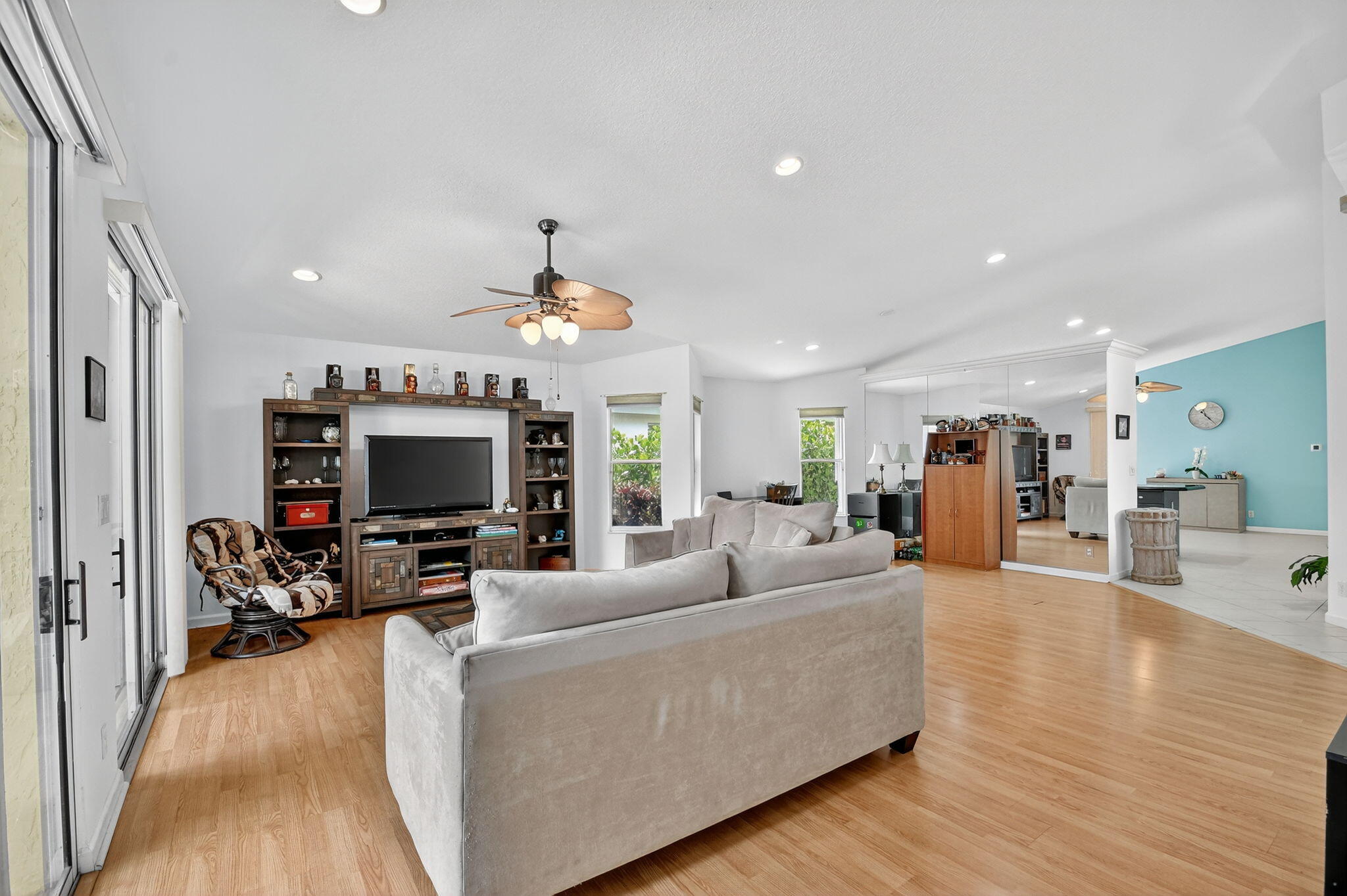 2804 Waters Edge Circle Greenacres, FL 33413 - Photo 11 of 74 a living room with furniture and a flat screen tv