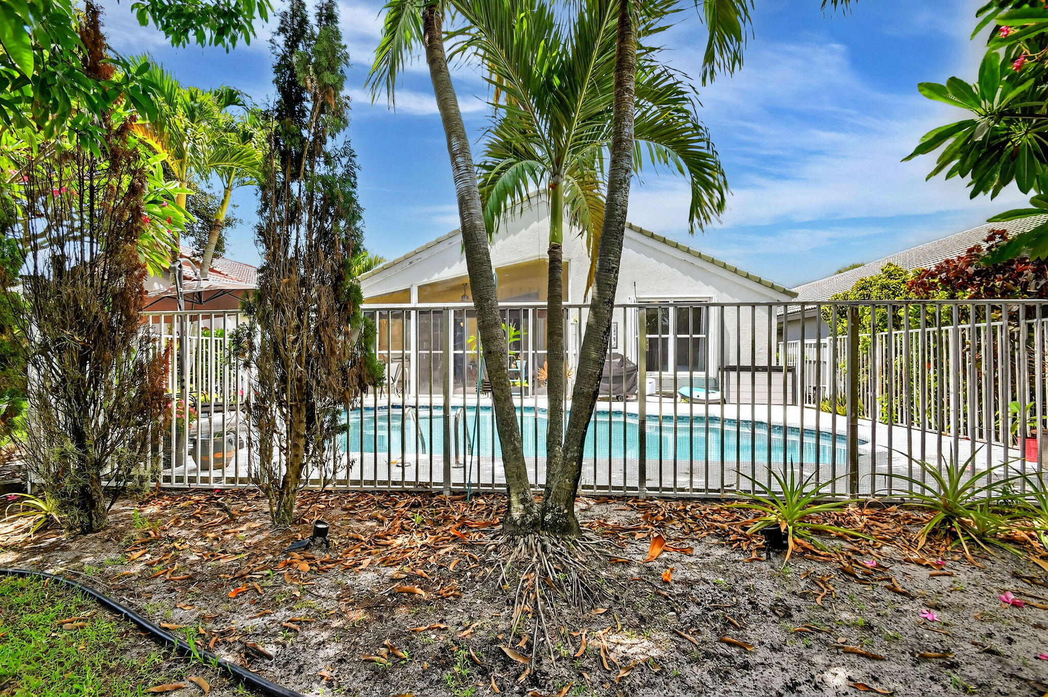 2804 Waters Edge Circle Greenacres, FL 33413 - Photo 49 of 74 front view of a house with a garden