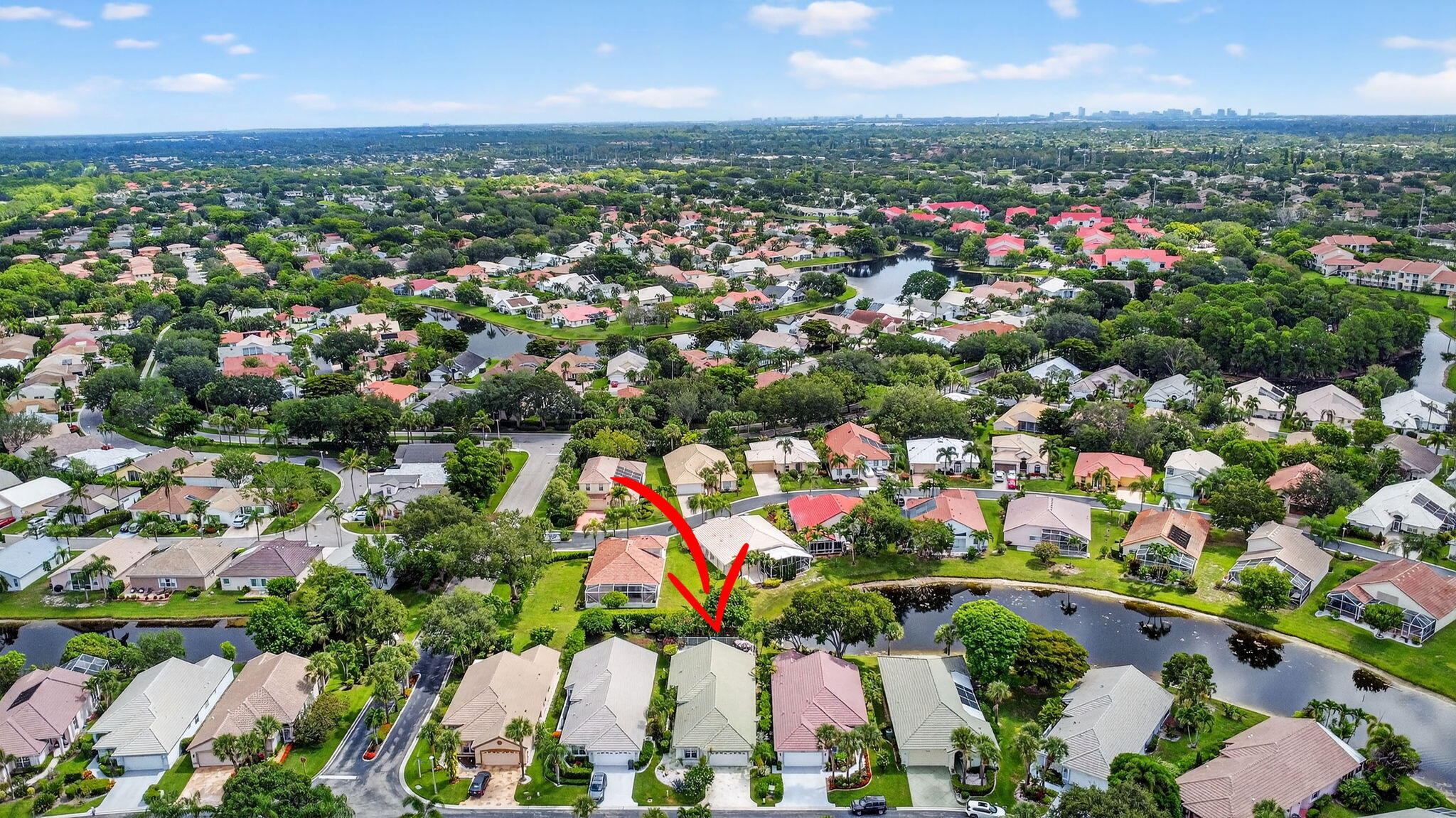 2804 Waters Edge Circle Greenacres, FL 33413 - Photo 52 of 74 an aerial view of residential houses with outdoor space and trees