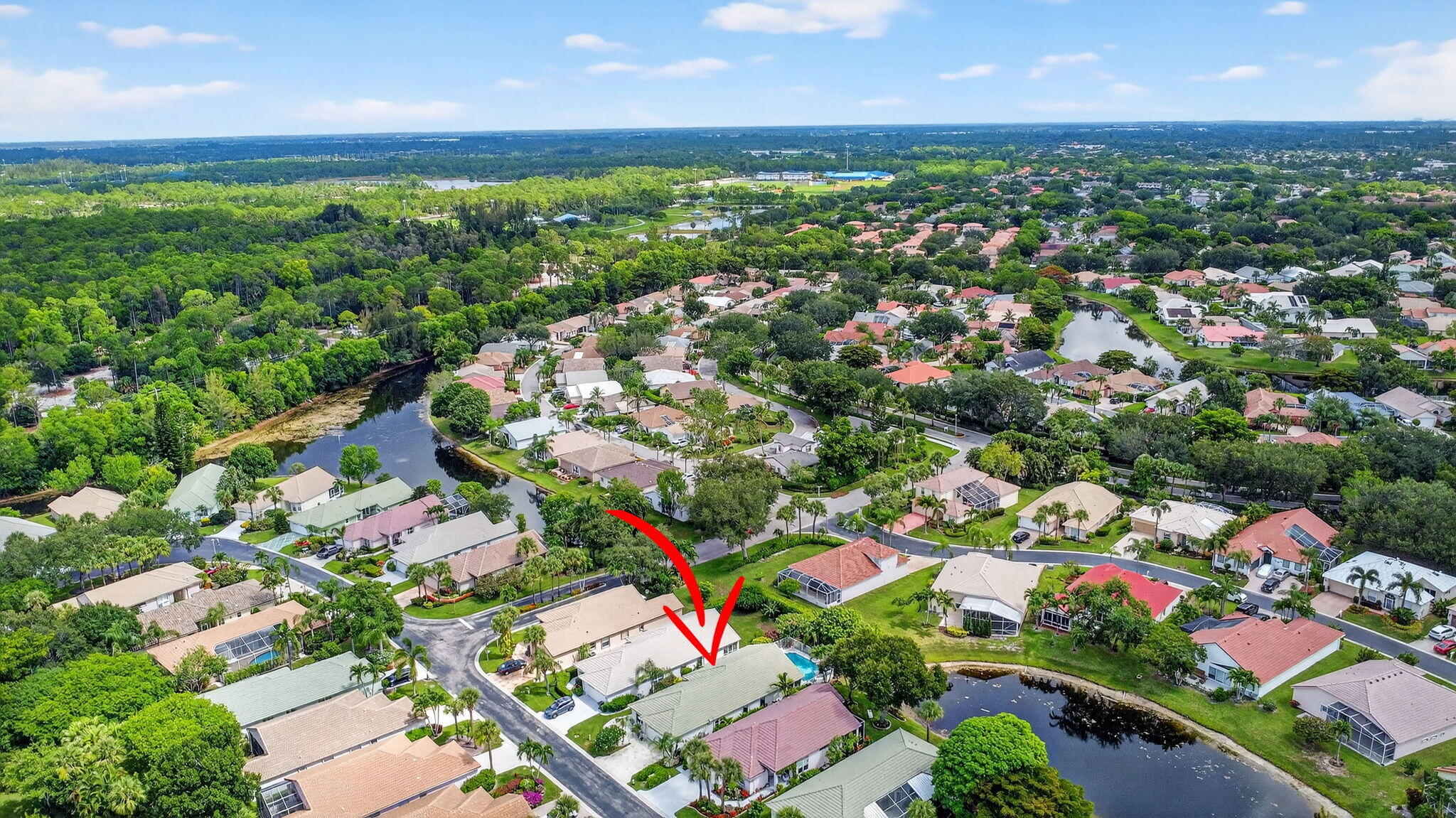 2804 Waters Edge Circle Greenacres, FL 33413 - Photo 53 of 74 an aerial view of residential houses with outdoor space and trees