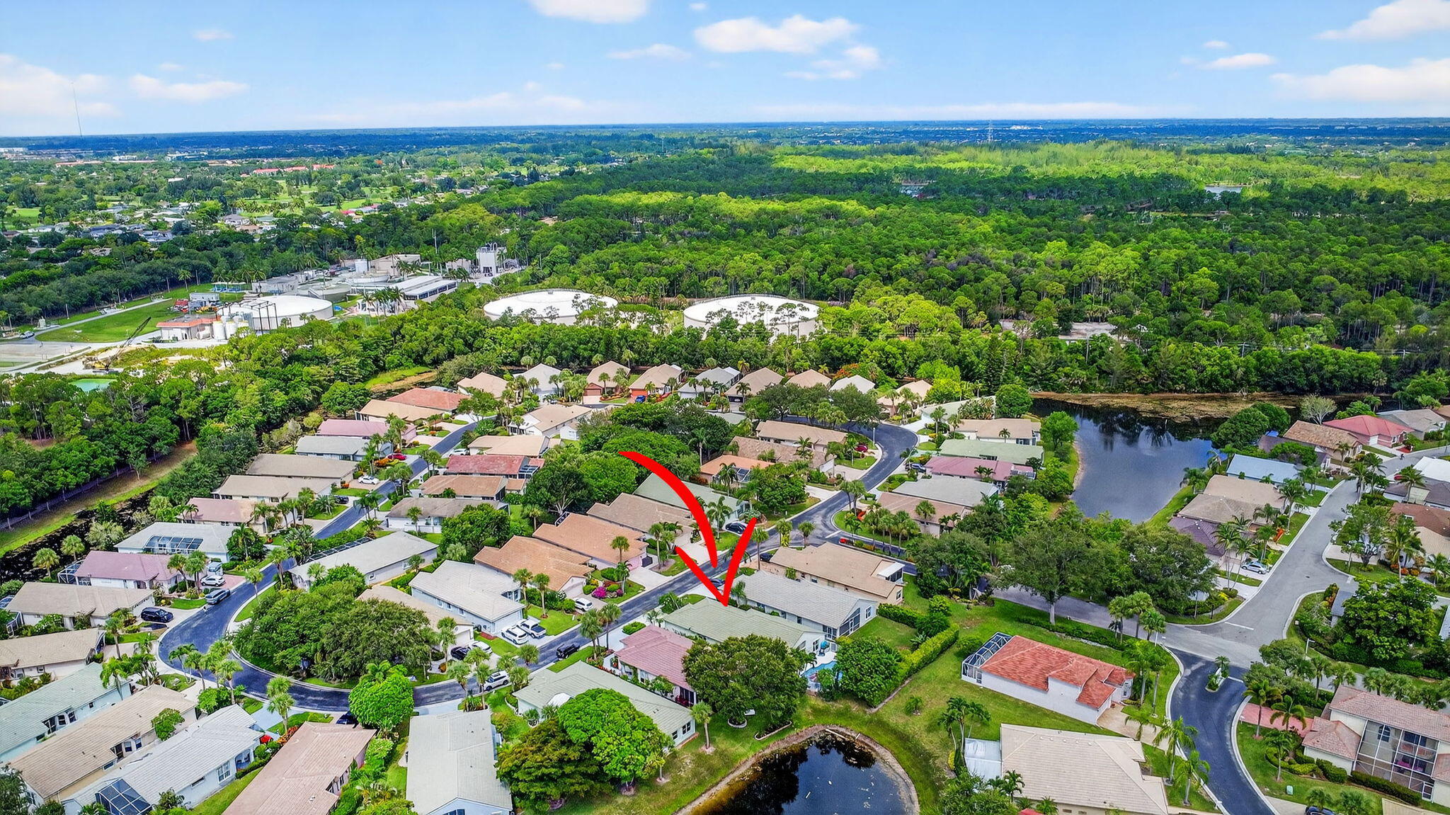 2804 Waters Edge Circle Greenacres, FL 33413 - Photo 54 of 74 a view of a lake with a city