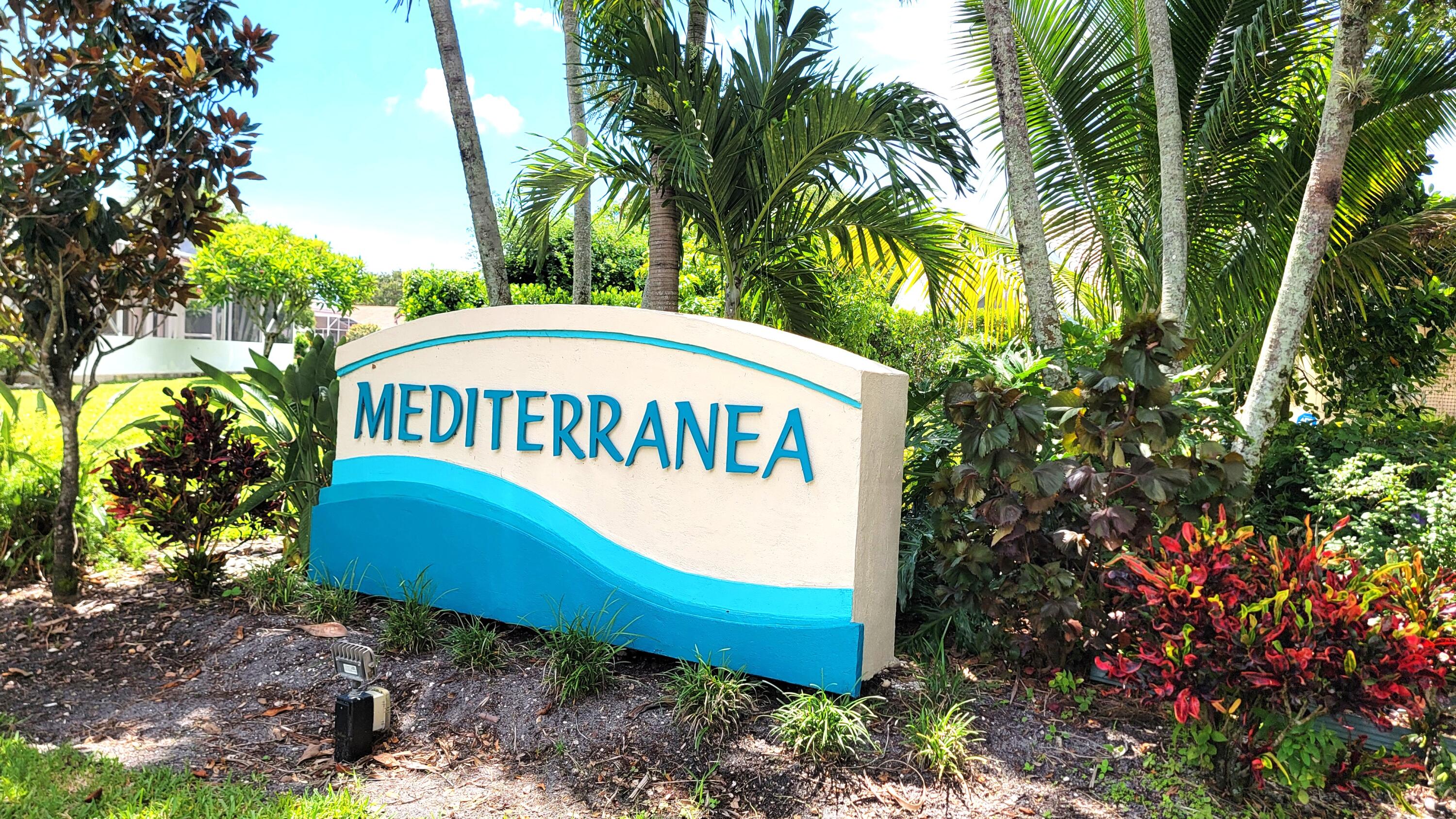 2804 Waters Edge Circle Greenacres, FL 33413 - Photo 58 of 74 a sign that is sitting in front of a tree