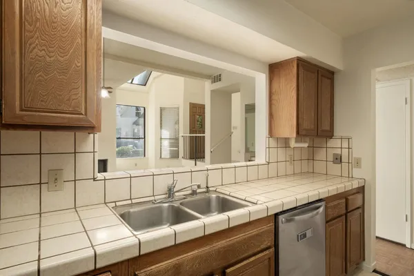 a kitchen with a sink and a window