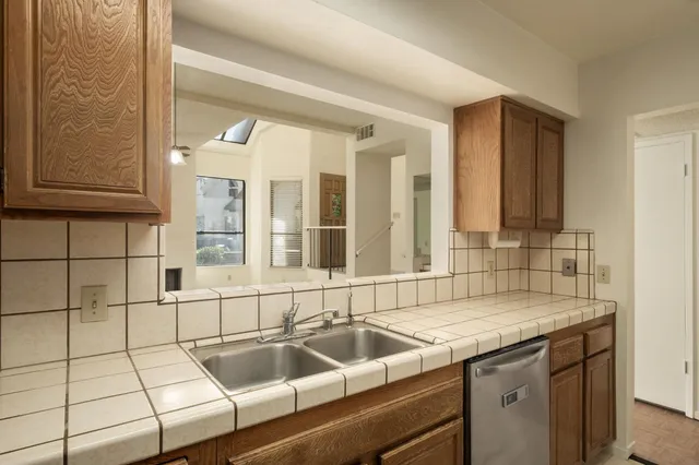 a kitchen with a sink and a window
