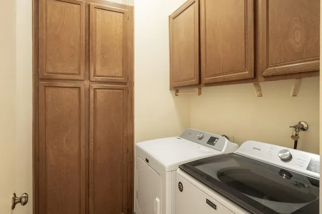 a utility room with dryer and washer