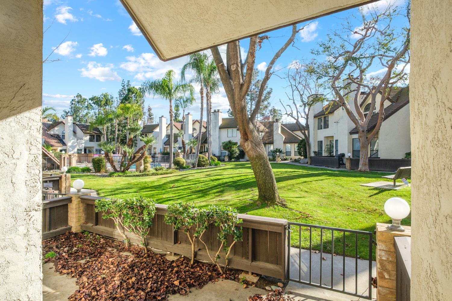 2890 Huntington Boulevard, Unit 149 Fresno, CA 93721 - Photo 26 of 30 a view of a backyard with sitting area and garden