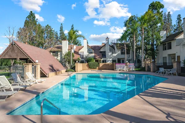 a view of swimming pool with outdoor seating