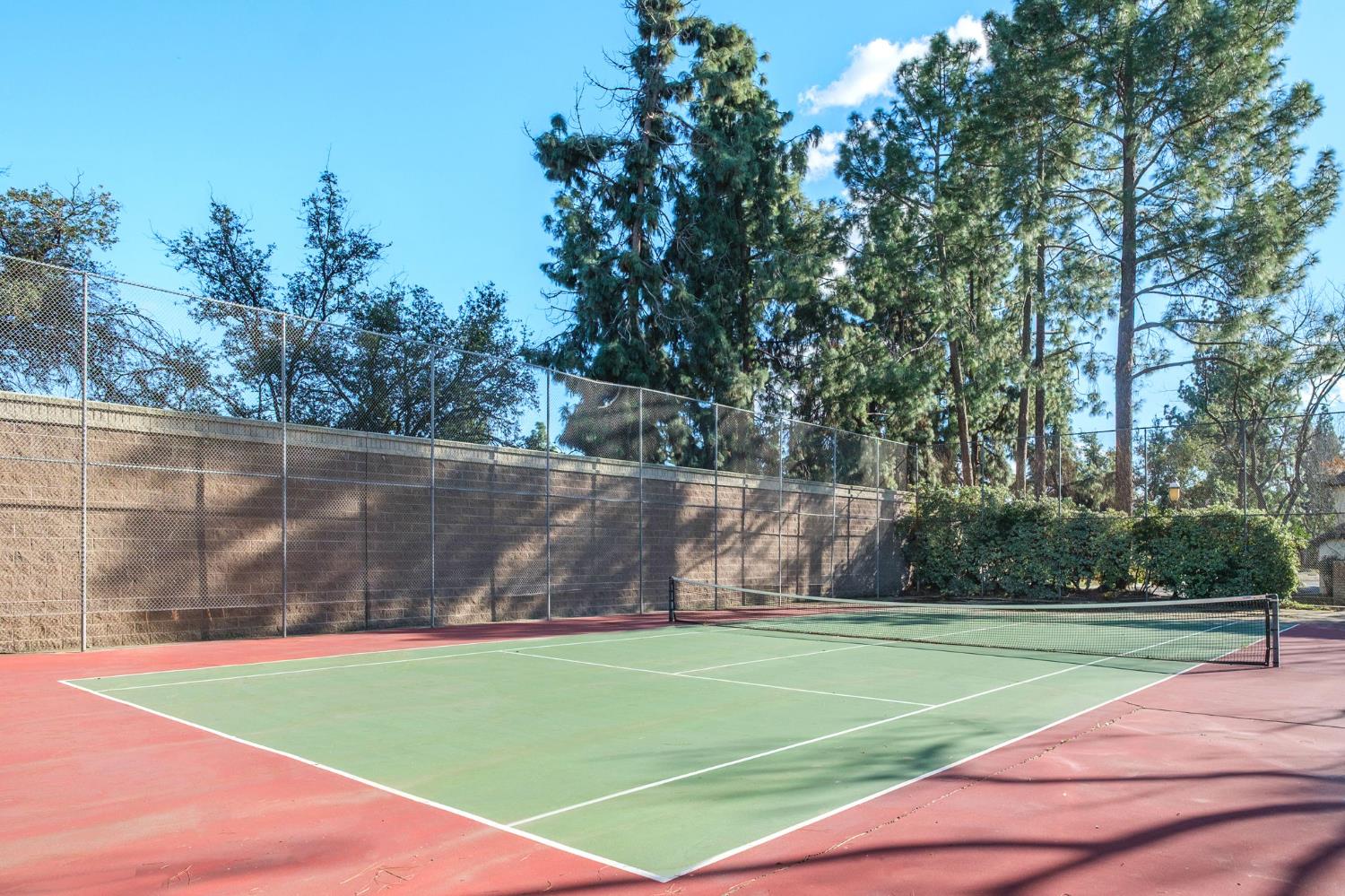 2890 Huntington Boulevard, Unit 149 Fresno, CA 93721 - Photo 29 of 30 a view of a tennis court