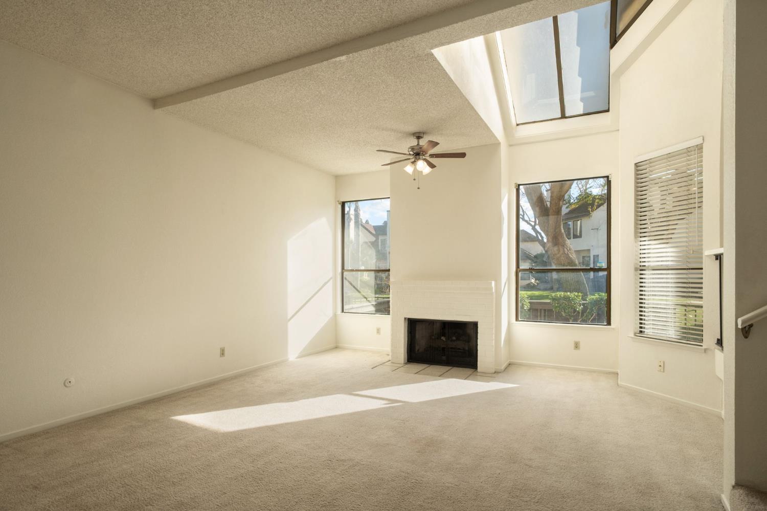 2890 Huntington Boulevard, Unit 149 Fresno, CA 93721 - Photo 6 of 30 a view of an empty room with a window