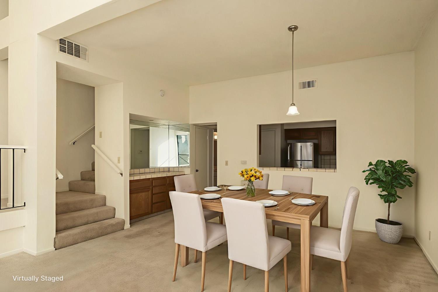 2890 Huntington Boulevard, Unit 149 Fresno, CA 93721 - Photo 10 of 30 a view of a dining room with furniture