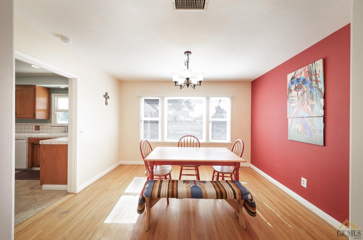 Undisclosed Address Bakersfield, CA 93308 - Photo 13 of 22 a view of a dining room with furniture window and wooden floor