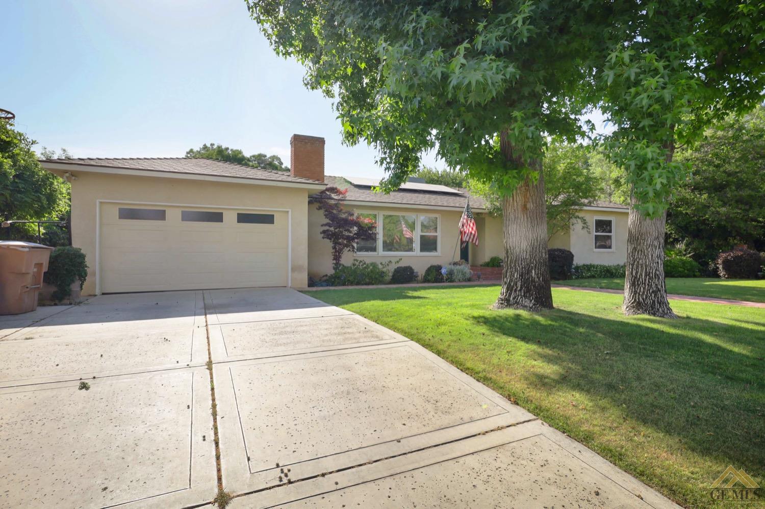 Undisclosed Address Bakersfield, CA 93308 - Photo 2 of 22 a front view of house with yard