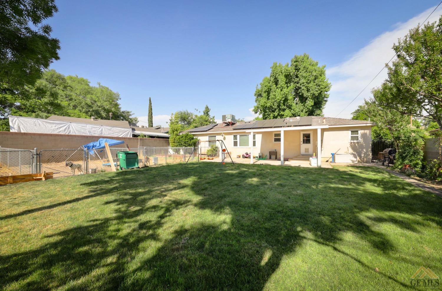 Undisclosed Address Bakersfield, CA 93308 - Photo 21 of 22 a view of a house with a yard