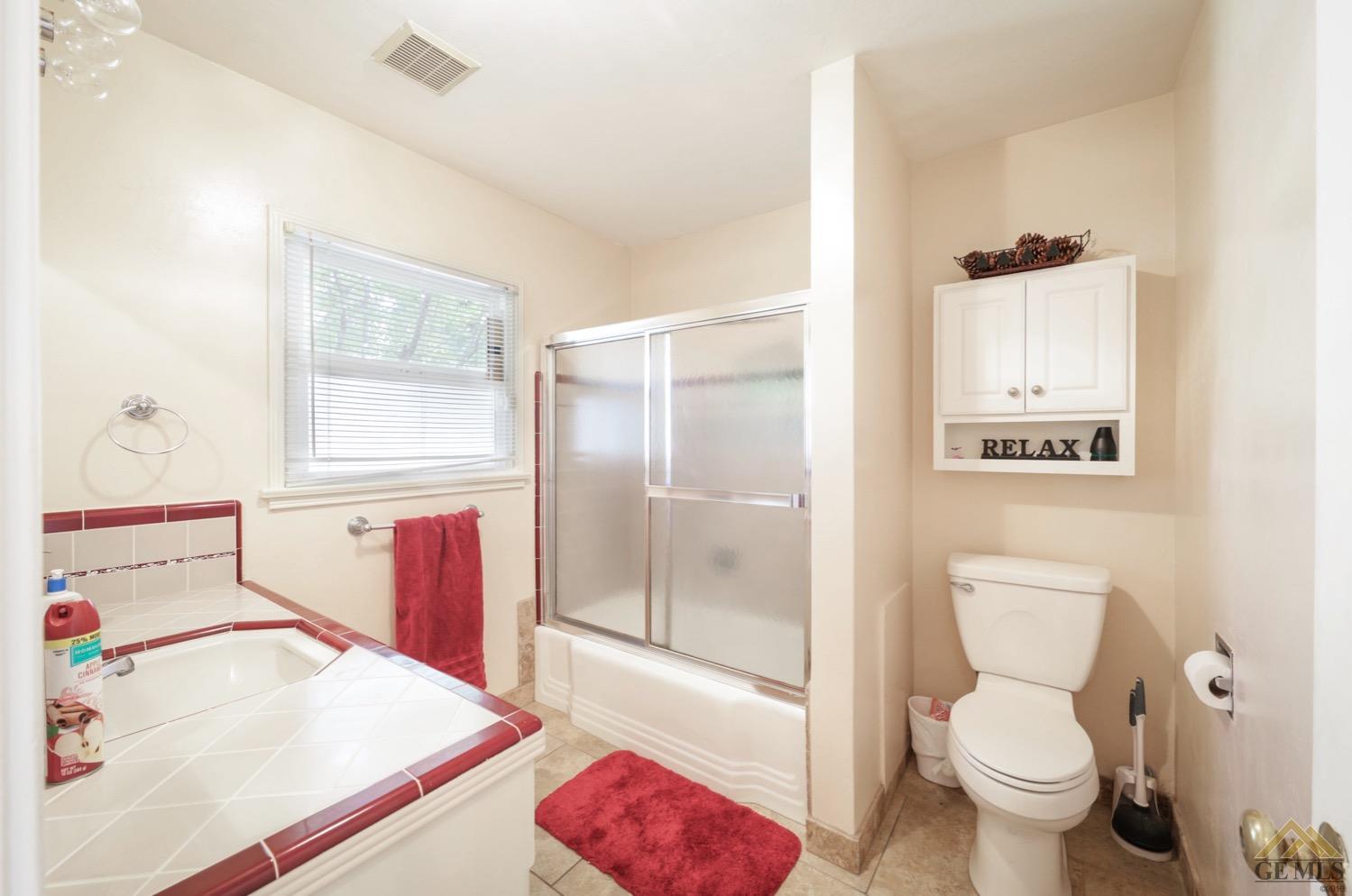 Undisclosed Address Bakersfield, CA 93308 - Photo 8 of 22 a bathroom with a sink toilet and shower