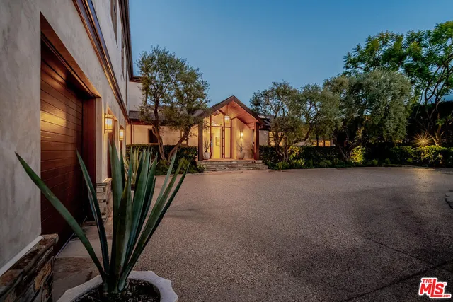 a view of a house with brick walls