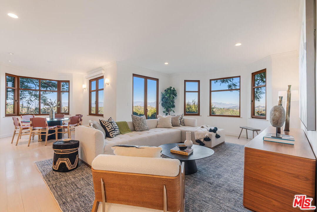 2232 Stradella Road Los Angeles, CA 90077 - Photo 12 of 48 a living room with furniture and a large window