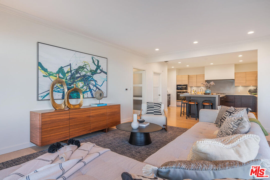 2232 Stradella Road Los Angeles, CA 90077 - Photo 13 of 48 a living room with furniture and a potted plant