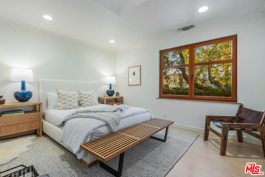 2232 Stradella Road Los Angeles, CA 90077 - Photo 17 of 48 a bedroom with a bed and a window