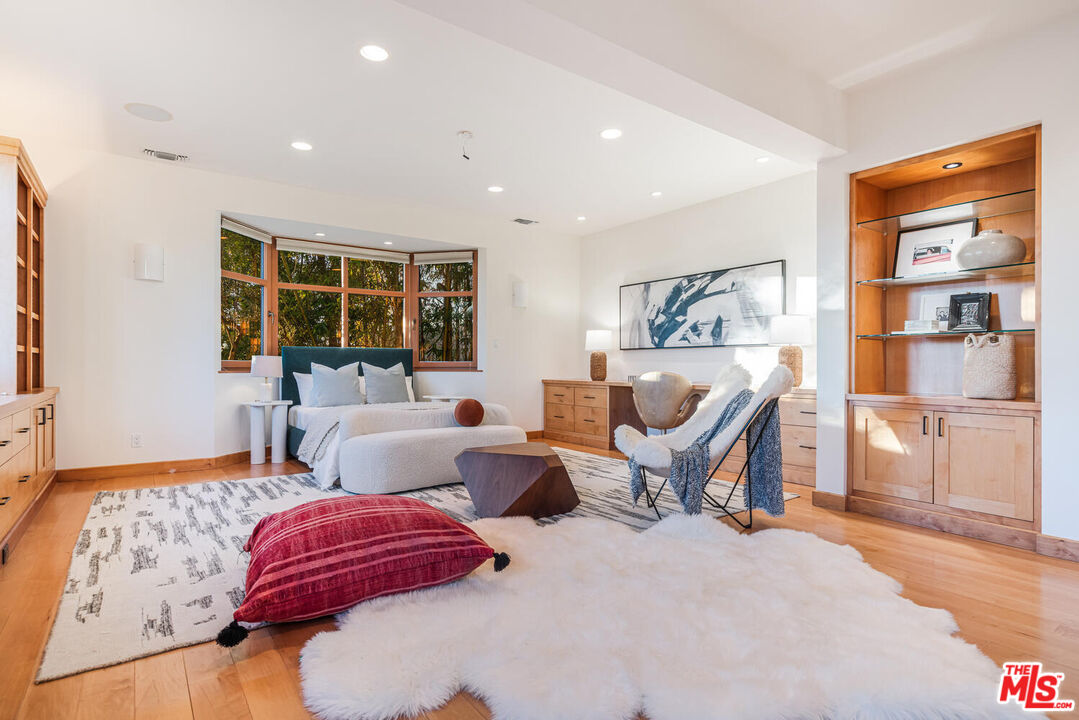 2232 Stradella Road Los Angeles, CA 90077 - Photo 21 of 48 a bedroom with furniture and a large window