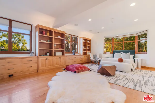 a bedroom with furniture and window