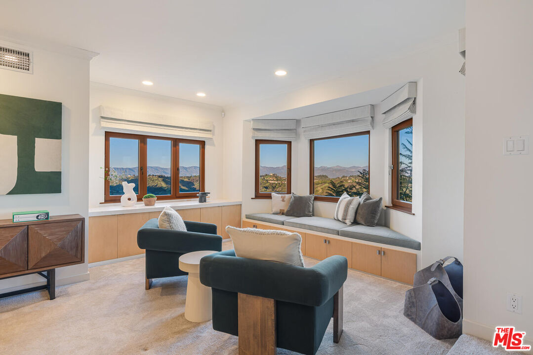 2232 Stradella Road Los Angeles, CA 90077 - Photo 26 of 48 a view of a dining room with furniture window and outside view