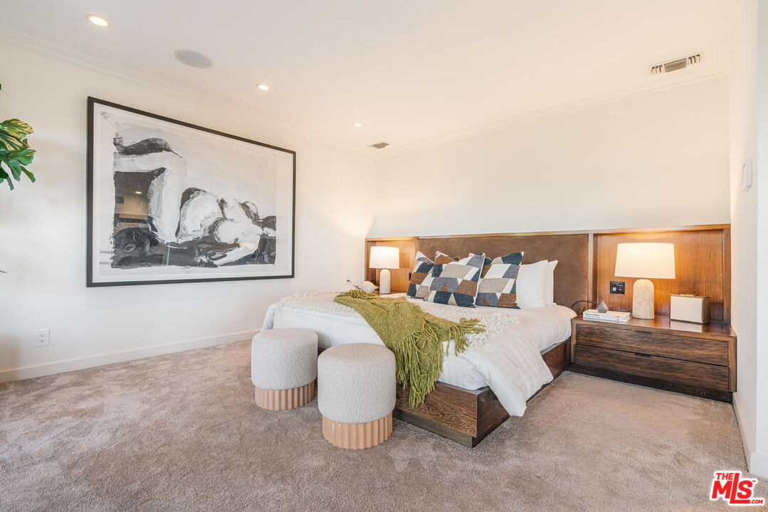 2232 Stradella Road Los Angeles, CA 90077 - Photo 27 of 48 a bedroom with a bed and a painting on the wall