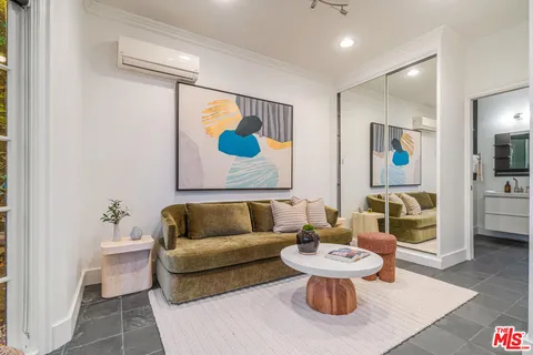 a living room with furniture and a rug