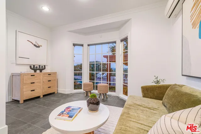 a bed room with a bed and a chair