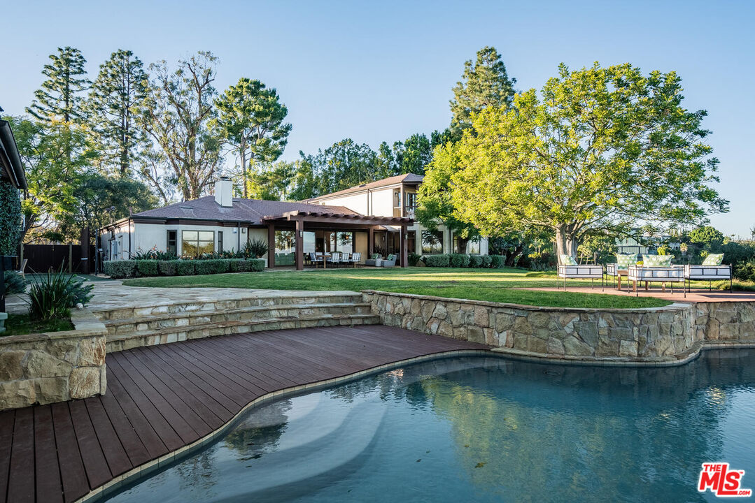 2232 Stradella Road Los Angeles, CA 90077 - Photo 35 of 48 a view of a house with a yard