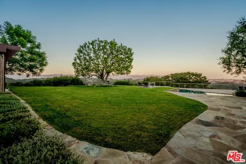 a view of a park with large trees