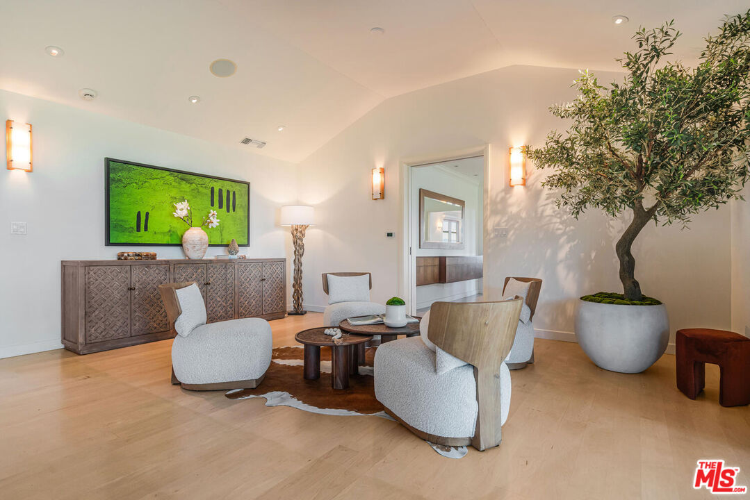 2232 Stradella Road Los Angeles, CA 90077 - Photo 7 of 48 a living room with furniture and a flat screen tv