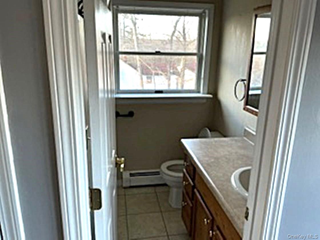 178 Pine Tree Road Monroe, NY 10950 - Photo 9 of 11 a bathroom with a granite countertop sink and a window