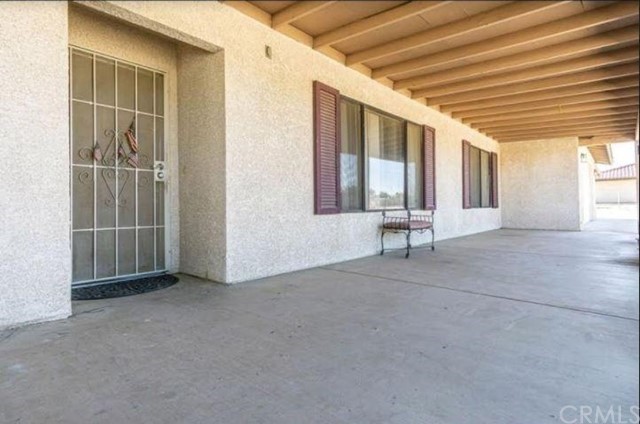Undisclosed Address Hesperia, CA 92345 - Photo 12 of 14 a view of an empty room with wooden floor and a window