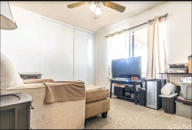 Undisclosed Address Hesperia, CA 92345 - Photo 4 of 14 a living room with furniture and a flat screen tv