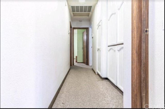 Undisclosed Address Hesperia, CA 92345 - Photo 10 of 14 a view of a hallway with wooden floor