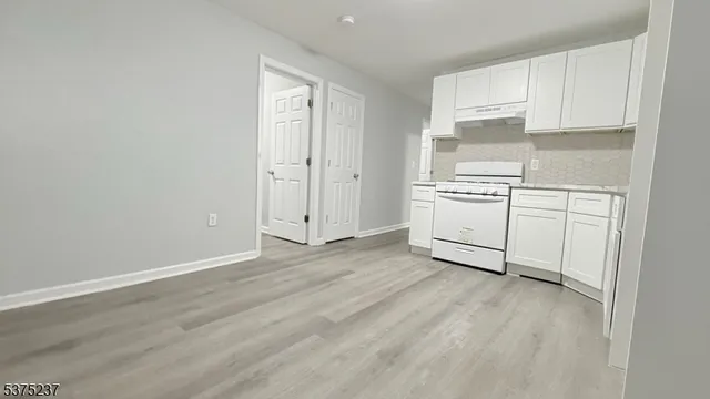 a room with cabinets and a wooden floor