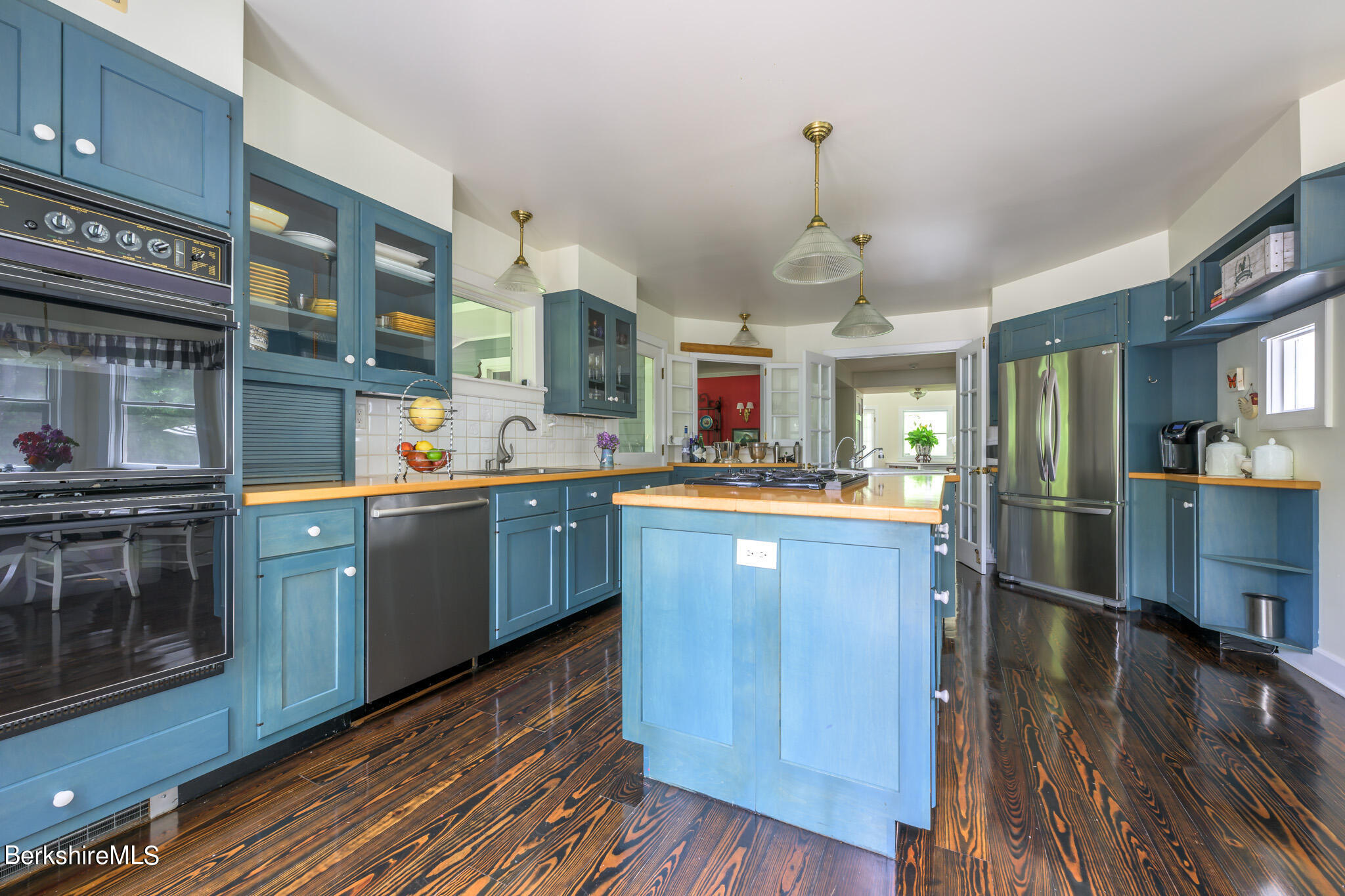 176 West Center Road West Stockbridge, MA 01266 - Photo 19 of 57 a kitchen with stainless steel appliances granite countertop wooden floors and view of living room